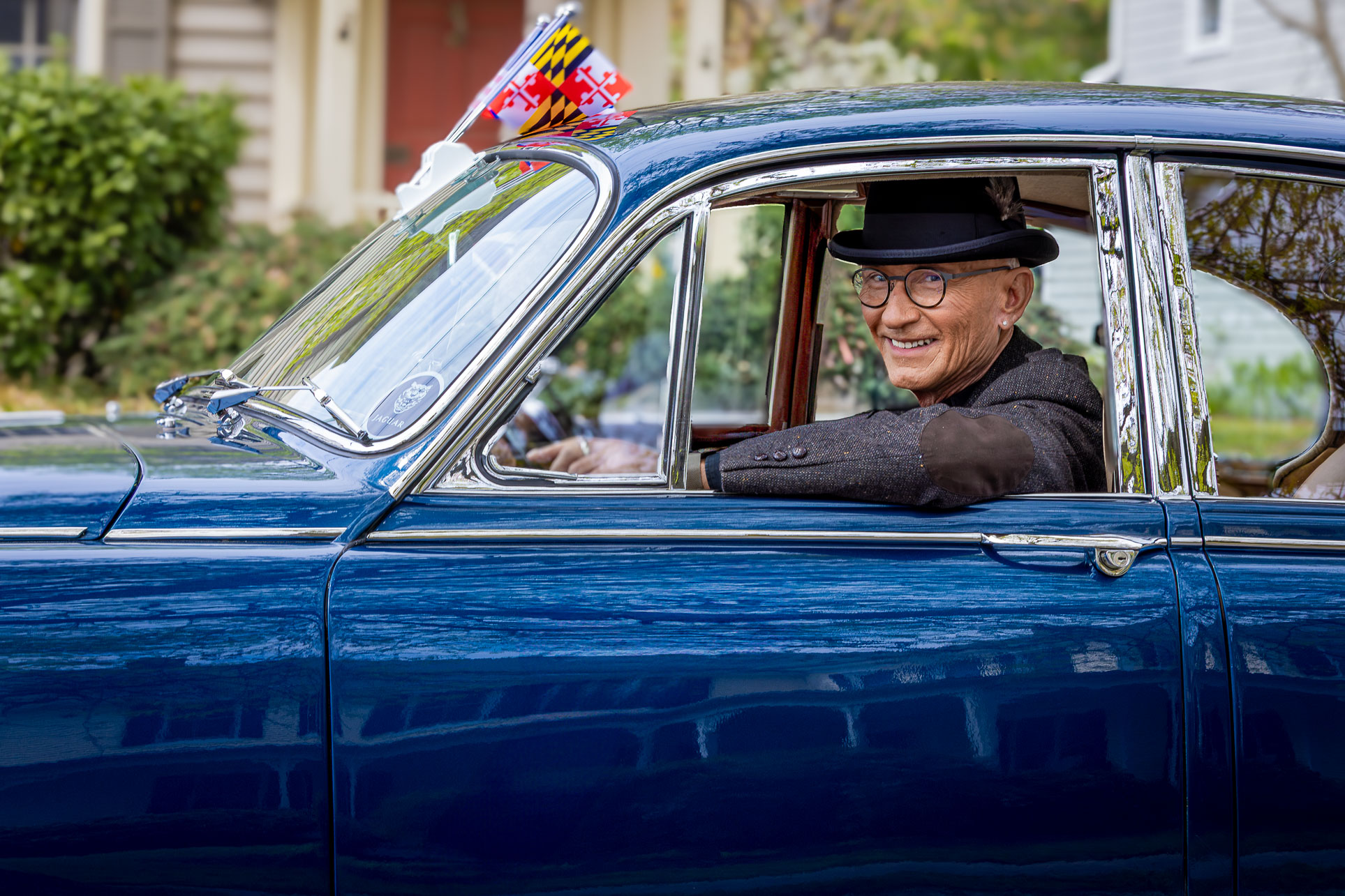 Portrait of an older man in a vintage car at the Oxford Day Parade, a timeless scene capturing local charm on Maryland’s Eastern Shore